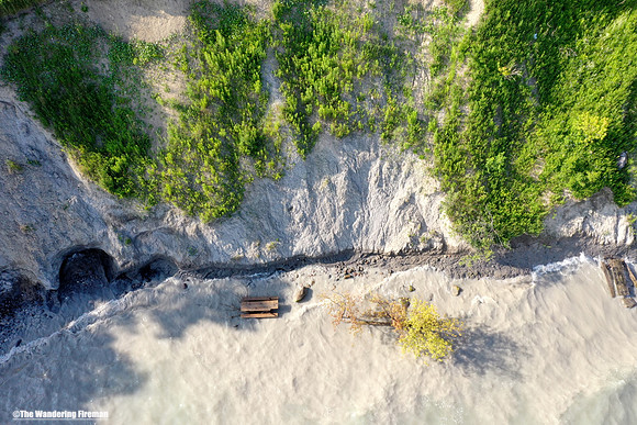 Drone image of a river cutaway through a landscape.