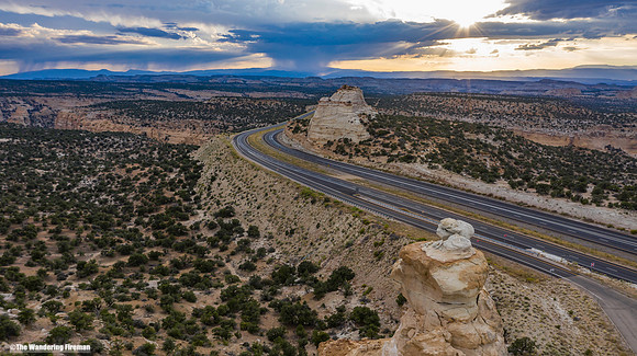 Drone image of a rainstorm in the distance in the landscape of south Utah.