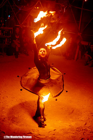 Fire baton performance in the Thunderdome of Burning Man in Black Rock City Nevada