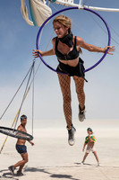 Woman on a swinging hoop at Burning Man in Black Rock City Nevada
