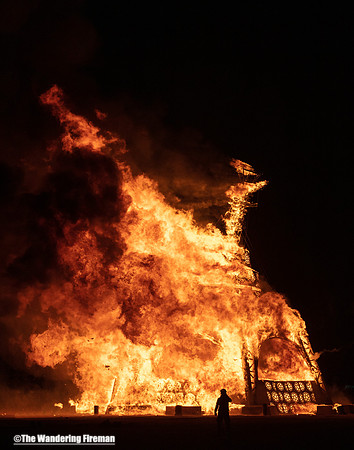 Lone Firefighter silhouetted at the Man burn...