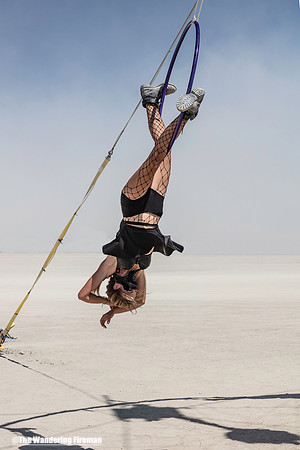 Solo hoop performer on art at Burning Man in Black Rock City Nevada