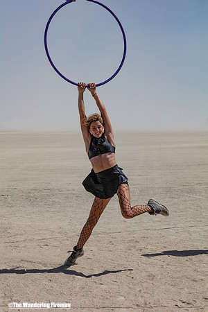 Woman hanging on a hoop at Burning Man in Black Rock City Nevada