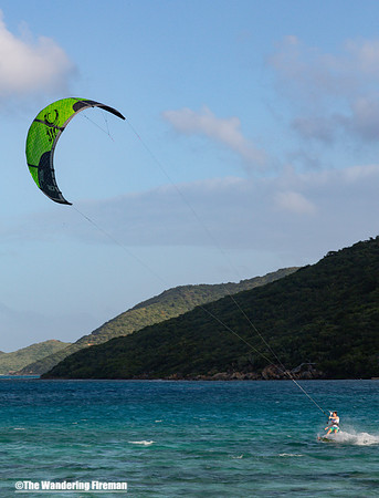 Kite surfer rides the waves