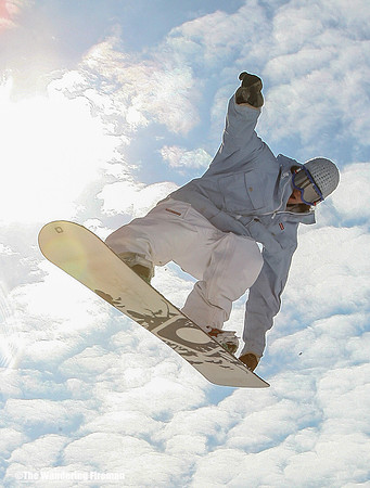 Snowboarding teen flies overhead