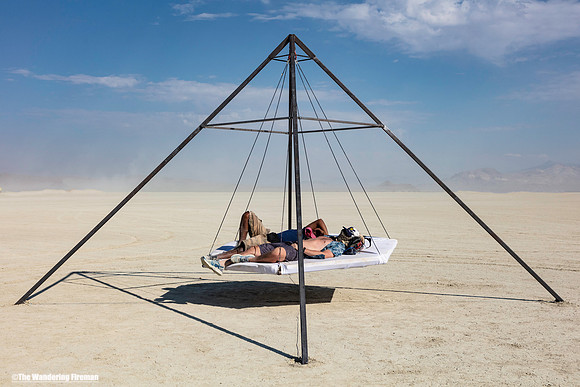 Resting on an art project at Burning Man
