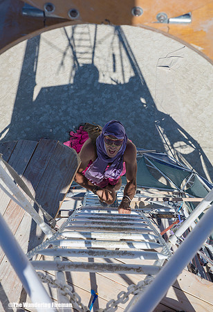 Climbing to the zip line at Burning Man