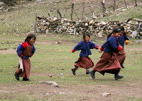 Children running in a Bhutanese schoolyard