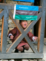 Young Bhutanese schoolboy shouts in a school yard