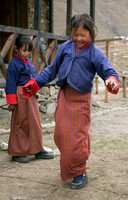 Two Bhutanese school girls playing hopscotch