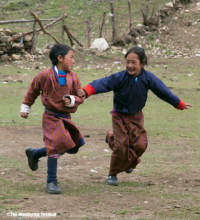 Two children in a Bhutanese schoolyard