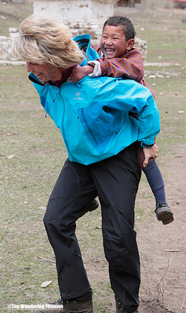 Giving a piggyback ride in Bhutan