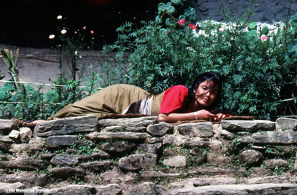 Sleeping Nepalese woman on the trail