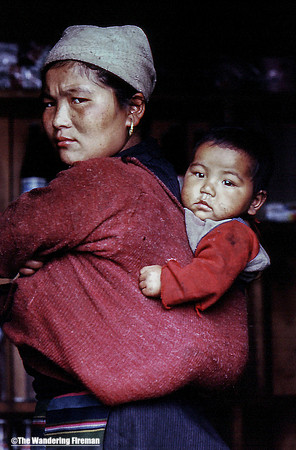 Mother and child in a papoose in Nepal