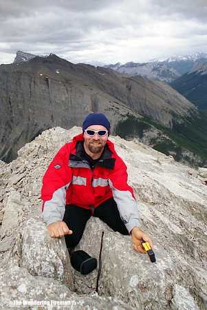 Climber on the summit of Tunnel Mountain in Alberta Canada