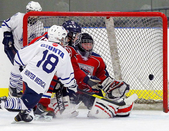 An ice hockey player scores a goal