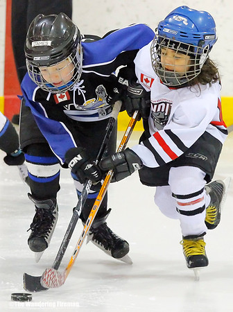 Battling for the puck in ice hockey