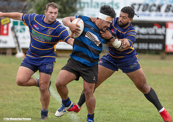 Fighting to break free from a rugby tackle