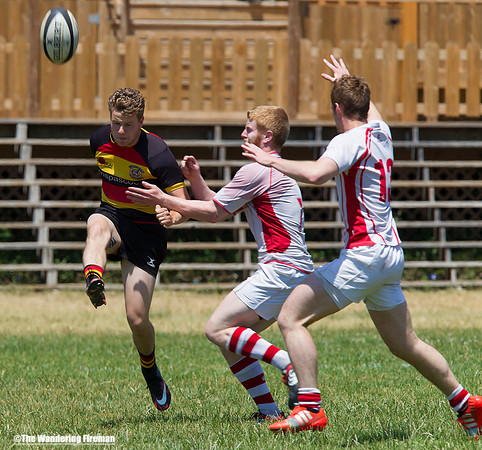 Rugby player kicks ball