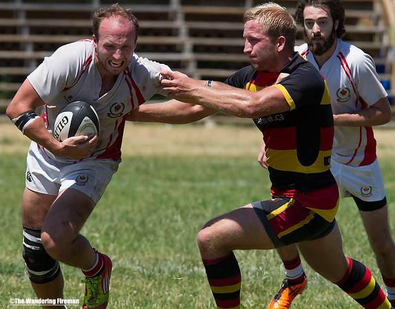 Fending off a rugby opponent