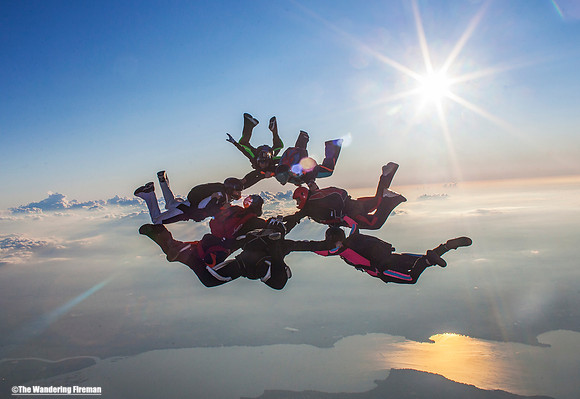 Formation skydive at sunset