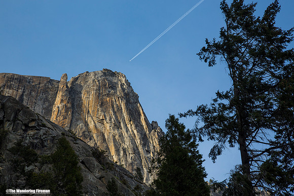 Contrail over a mountainside
