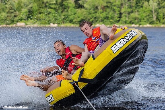 Falling off the side of a tube being pulled behind a boat