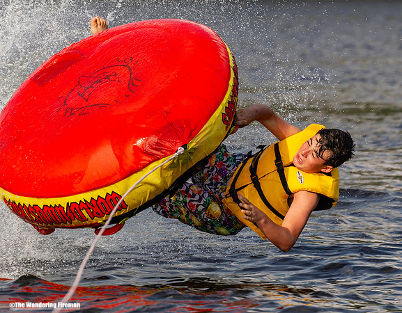 Solo tube rider flips his tube