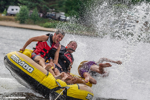 Getting thrown out of a three man tube behind a boat