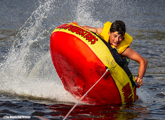 Speed demon on a tube being pulled behind a boat