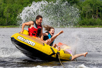 Falling of a tube being pulled behind a boat