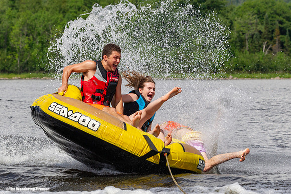 Falling of a tube being pulled behind a boat