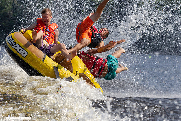 Three teens are ejected from a tube being pulled behind a boat