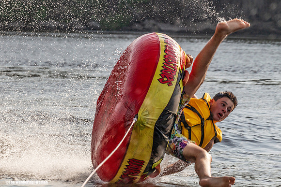 Solo tube rider teeters on losing balance