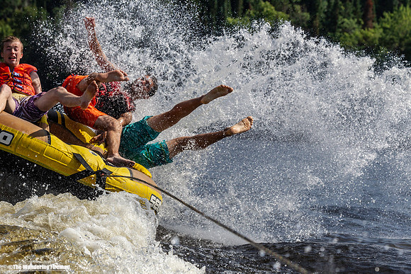 Three teens get pitched out of a tube being pulled behind a boat