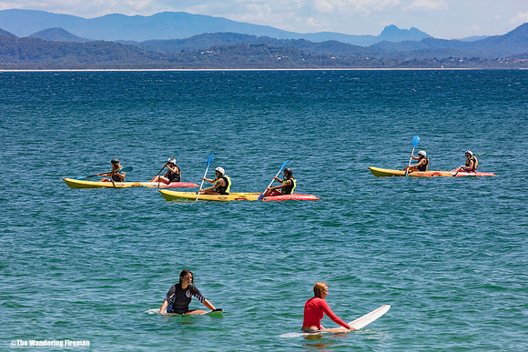 Surfers and Kayakers in Byron Bay