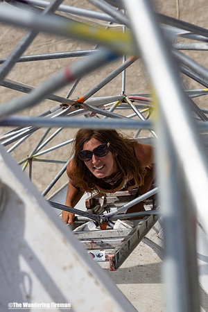 Climbing up the zip line at Burning Man