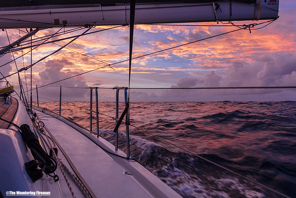 A clourful sunset on the Pacific aboard the Aranui Yacht
