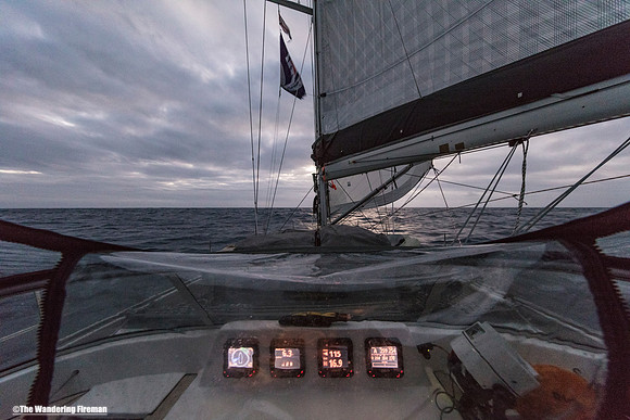 Looking over the bow of the Aranui yacht while asail on the Pacific Ocean