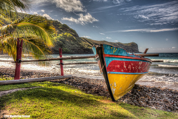 Boat on coastal Hiva Oa, French Polynesia