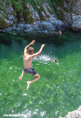 A teen leaps into the Pelorus river of New Zealand
