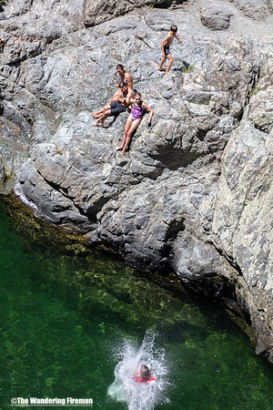 Kids splashing into the Pelorus river in New Zealand