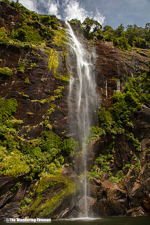 Waterfall in Milford Sound New Zealand