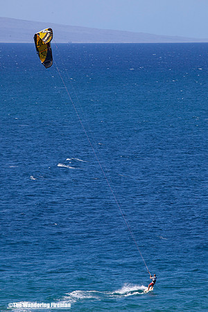 Kite surfer skimming the Pacific in Maui Hawaii