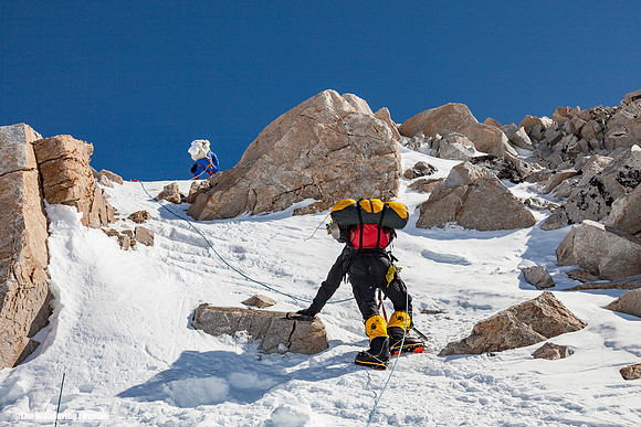 A mountain climber picks throug the rocks on the West Buttress ridge on Denali, Alaska, the highest mountain in North America