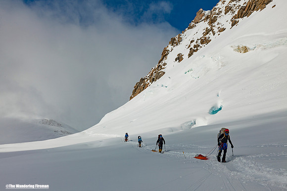 Climbing around windy corner of Denali, Alaska, the highest mountain in North America