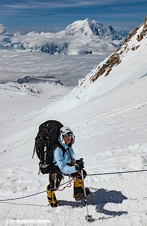 Lisa approaches the West Buttress with Mount Foraker in the background on Denali, Alaska, the highest mountain in North America