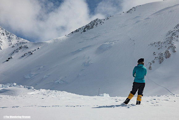 Lisa watches while we put picketts into the ice along the Autobahn of Denali, Alaska, the highest mountain in North America