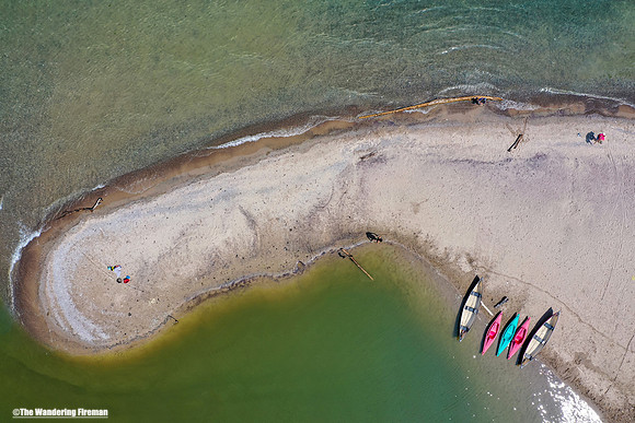 Kayaks beached on a sand bar