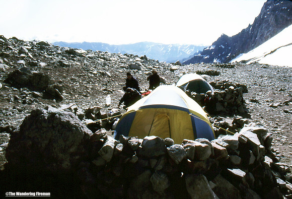 A stone wall protects a tent at camp one on Aconcagua